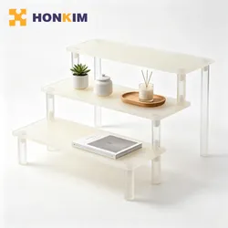 Maßgeschneiderter Farb-Acryl-Riser-Regal für Kosmetik-Thekenlagerung