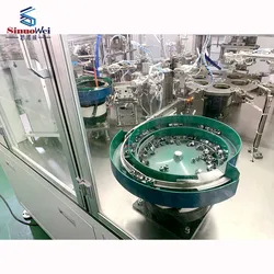 Macchina per la produzione automatica di fascette per tubi