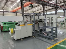 Machine de rembobinage automatique pour machine d'extrusion de tuyaux