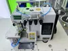 Macchina da cucire overlock pneumatico reversibile a quattro fili ad alta velocità con bloccaggio finale del filo