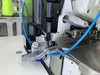 Macchina da cucire overlock pneumatico reversibile a quattro fili ad alta velocità con bloccaggio finale del filo