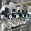 Máquina multifunción de taponado y envasado con bomba rotativa