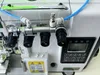 Macchina da cucire overlock pneumatico reversibile a quattro fili ad alta velocità con bloccaggio finale del filo