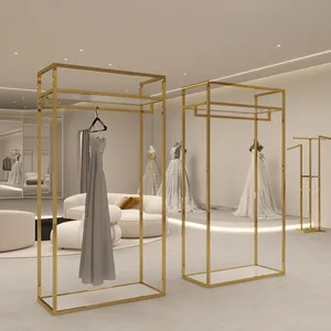 Suportes de roupas personalizados por atacado, suportes de exibição, cabide para roupas, cabide de roupas dourado, suporte de exibição de roupas para loja, suporte de metal montado na parede para boutique